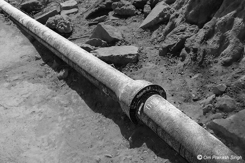 Exposed Ductile Iron (DI) pipes bringing water from a newly installed MVS under Jal Jeevan Mission in Khunti district, Jharkhand, India